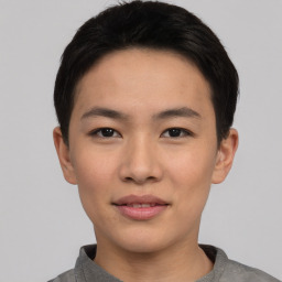 Joyful asian young-adult male with short  black hair and brown eyes