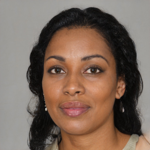 Joyful black adult female with medium  black hair and brown eyes