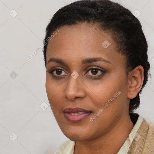 Joyful black young-adult female with short  brown hair and brown eyes