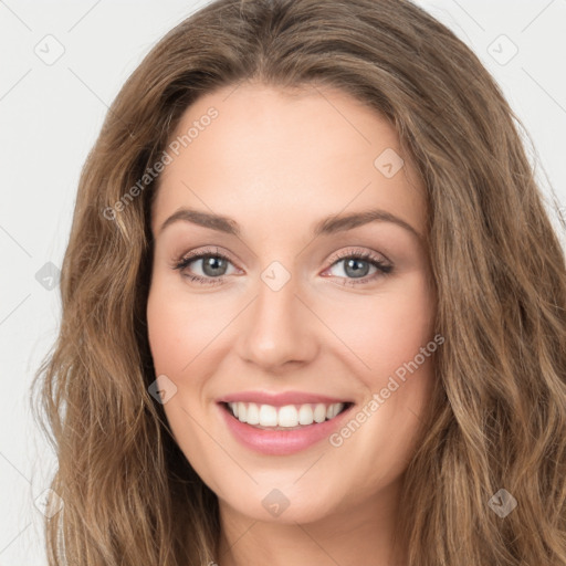 Joyful white young-adult female with long  brown hair and green eyes