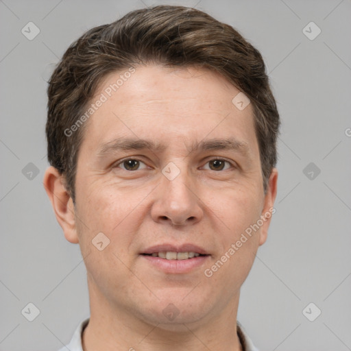 Joyful white adult male with short  brown hair and grey eyes