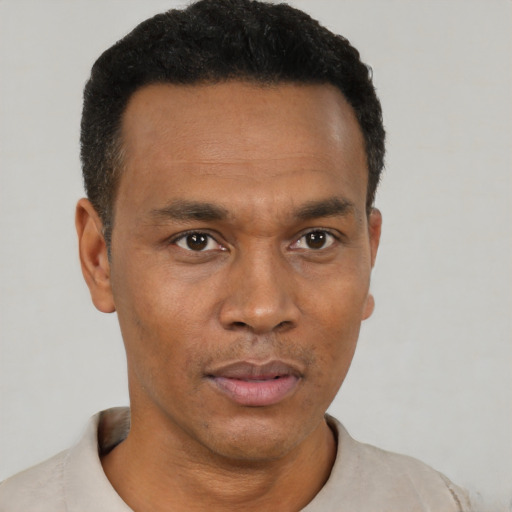 Neutral black young-adult male with short  black hair and brown eyes
