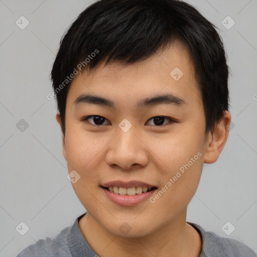 Joyful asian young-adult male with short  black hair and brown eyes