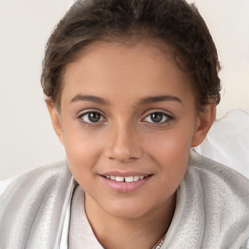 Joyful white child female with short  brown hair and brown eyes