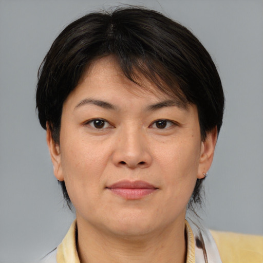 Neutral asian adult female with medium  brown hair and brown eyes