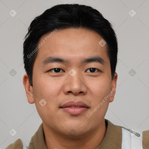 Joyful asian young-adult male with short  black hair and brown eyes