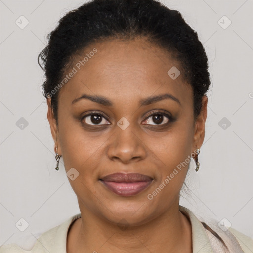 Joyful black young-adult female with short  brown hair and brown eyes