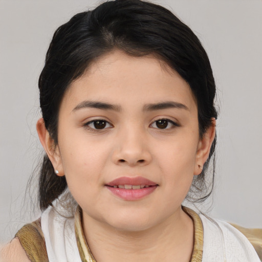 Joyful asian child female with medium  brown hair and brown eyes