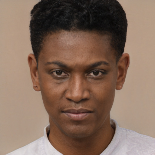 Joyful black young-adult male with short  black hair and brown eyes