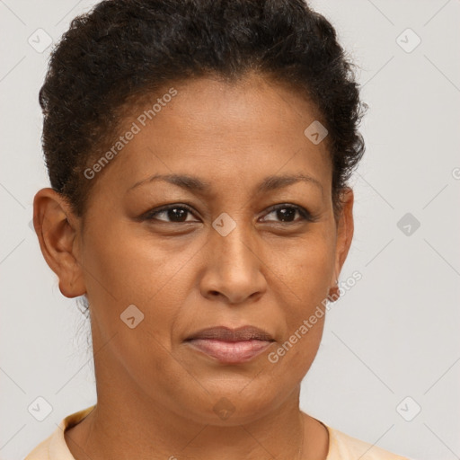 Joyful latino adult female with short  brown hair and brown eyes