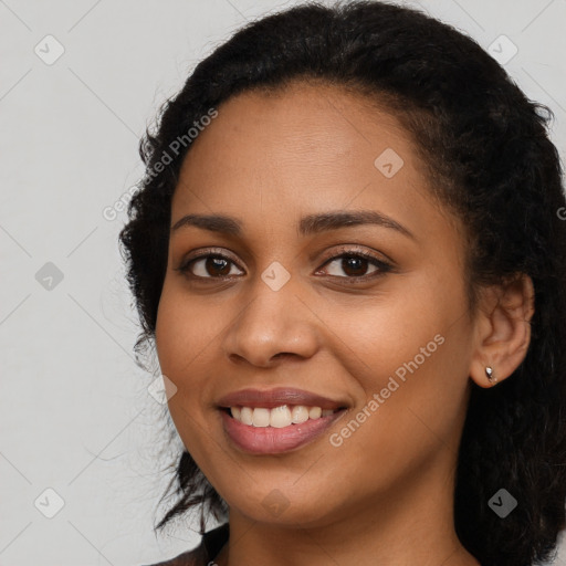 Joyful latino young-adult female with long  black hair and brown eyes