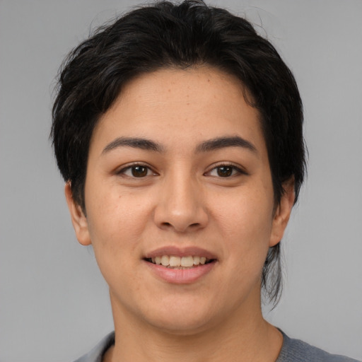 Joyful asian young-adult female with medium  brown hair and brown eyes