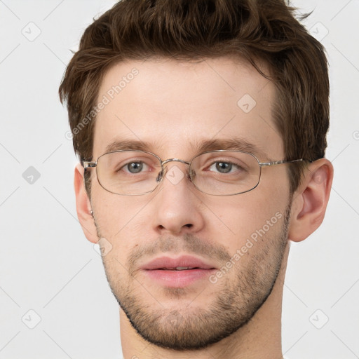 Joyful white adult male with short  brown hair and grey eyes