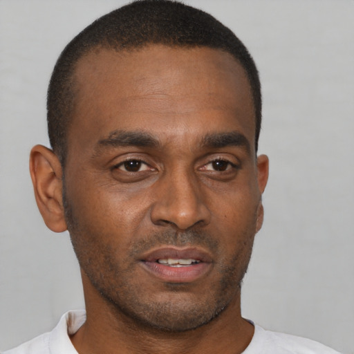 Neutral black young-adult male with short  brown hair and brown eyes