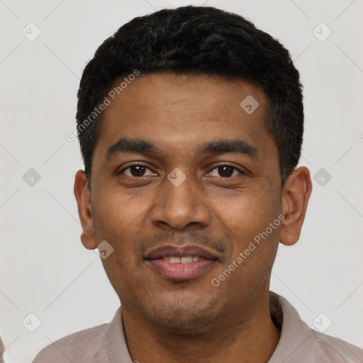 Joyful latino young-adult male with short  black hair and brown eyes