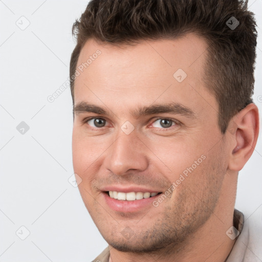 Joyful white young-adult male with short  brown hair and brown eyes