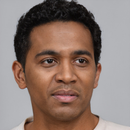 Neutral black young-adult male with short  black hair and brown eyes