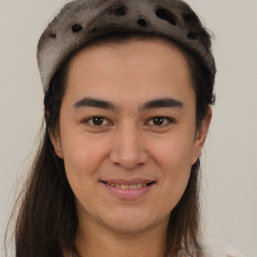 Joyful latino young-adult female with long  brown hair and brown eyes