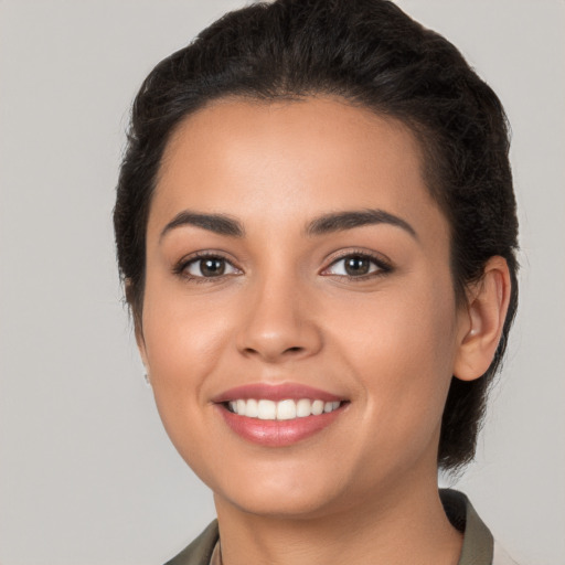 Joyful white young-adult female with long  brown hair and brown eyes