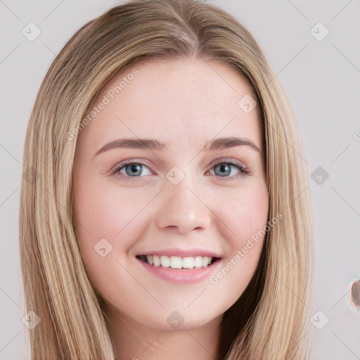 Joyful white young-adult female with long  brown hair and blue eyes