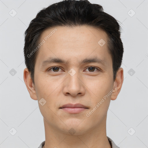 Joyful white young-adult male with short  brown hair and brown eyes