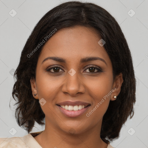 Joyful black young-adult female with medium  brown hair and brown eyes