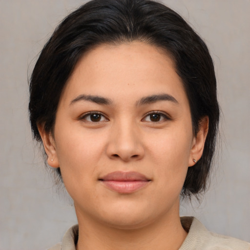 Joyful asian young-adult female with medium  brown hair and brown eyes