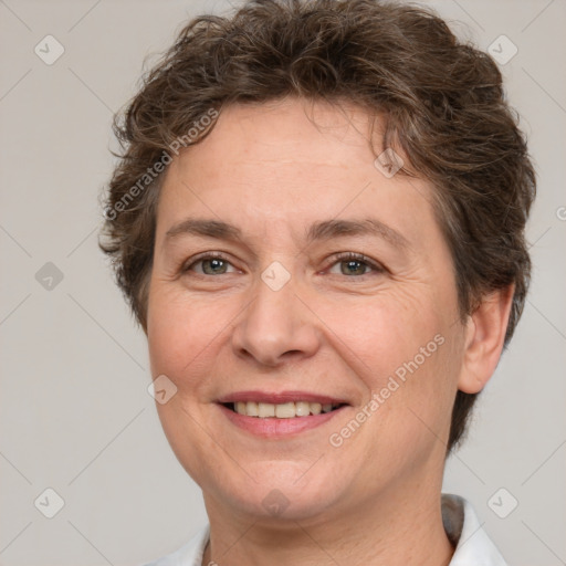 Joyful white adult female with short  brown hair and brown eyes