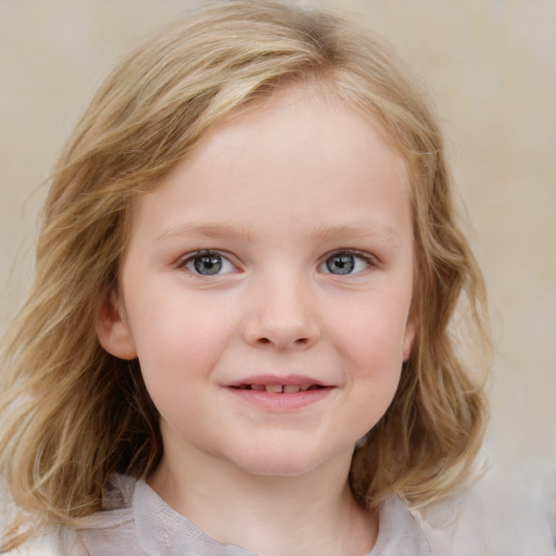 Joyful white child female with medium  brown hair and blue eyes