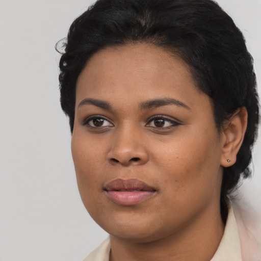 Joyful latino young-adult female with short  black hair and brown eyes