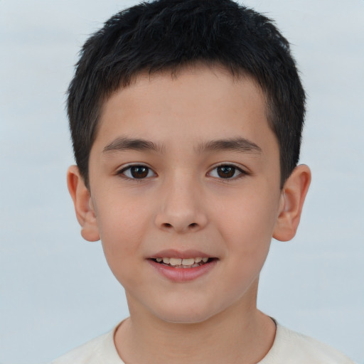 Joyful white child male with short  brown hair and brown eyes