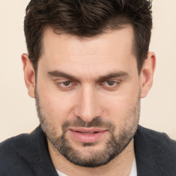 Joyful white young-adult male with short  brown hair and brown eyes