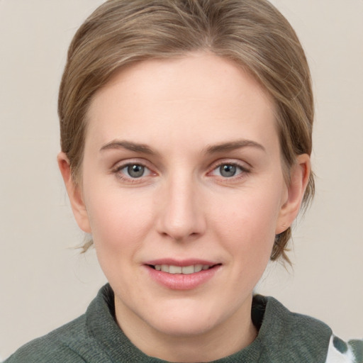 Joyful white young-adult female with medium  brown hair and blue eyes