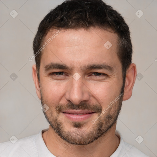 Joyful white adult male with short  brown hair and brown eyes