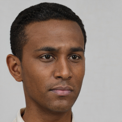Neutral black young-adult male with short  brown hair and brown eyes