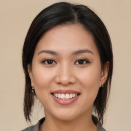 Joyful white young-adult female with medium  brown hair and brown eyes