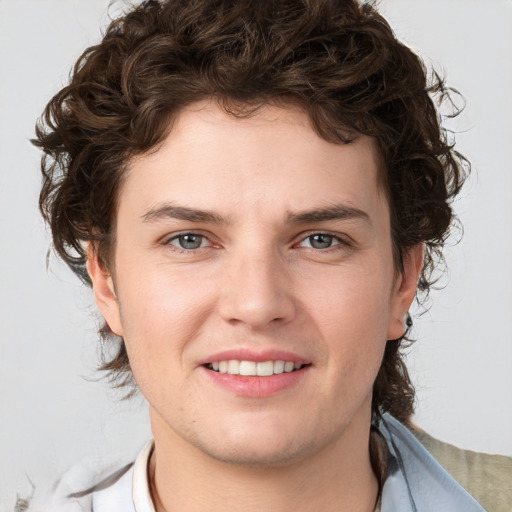 Joyful white young-adult male with medium  brown hair and brown eyes