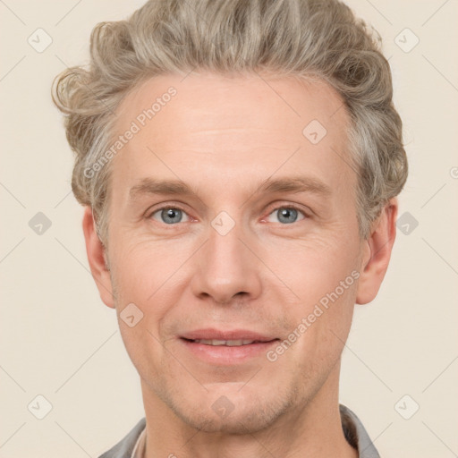 Joyful white adult male with short  brown hair and grey eyes