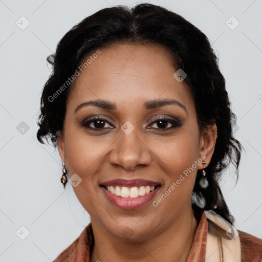 Joyful black young-adult female with long  black hair and brown eyes