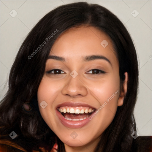 Joyful latino young-adult female with long  black hair and brown eyes