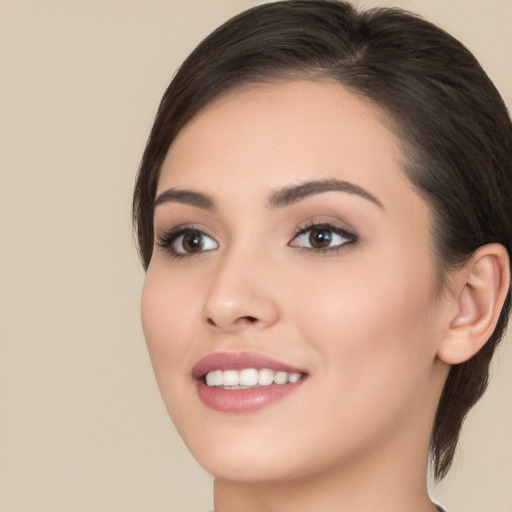 Joyful white young-adult female with medium  brown hair and brown eyes