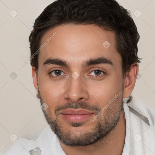 Joyful white young-adult male with short  brown hair and brown eyes