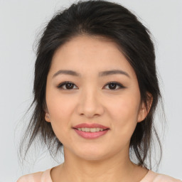 Joyful asian young-adult female with medium  brown hair and brown eyes