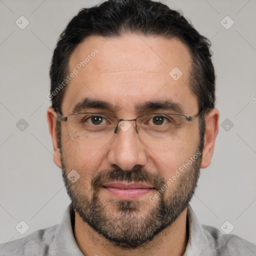 Joyful white adult male with short  black hair and brown eyes