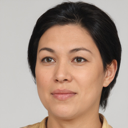 Joyful white adult female with medium  brown hair and brown eyes
