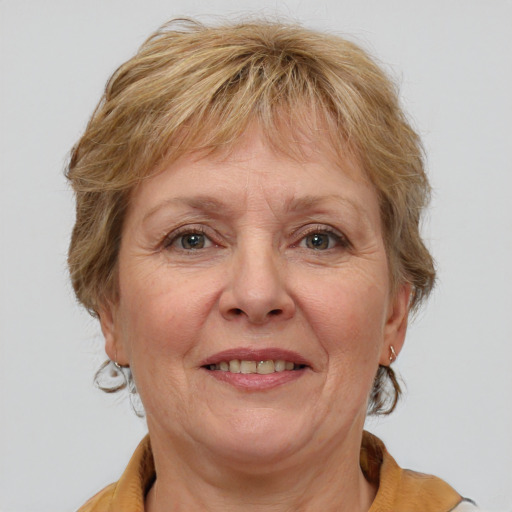 Joyful white middle-aged female with medium  brown hair and grey eyes