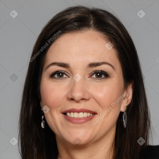 Joyful white adult female with long  brown hair and brown eyes