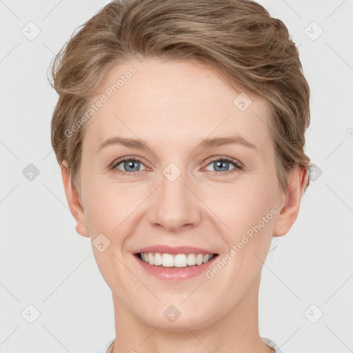 Joyful white young-adult female with short  brown hair and grey eyes