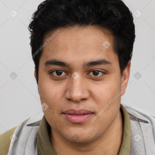 Joyful latino young-adult male with short  brown hair and brown eyes