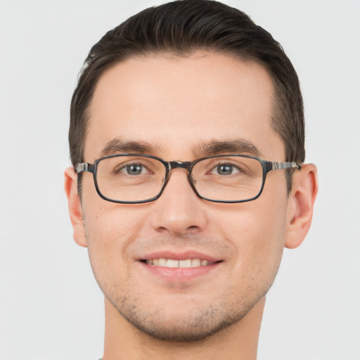 Joyful white young-adult male with short  brown hair and brown eyes